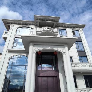 北海白麻别墅外墙干挂石材效果示例